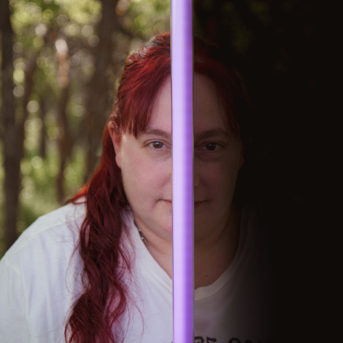 Lisa's profile showing light & dark with a light-saber in held up to her face